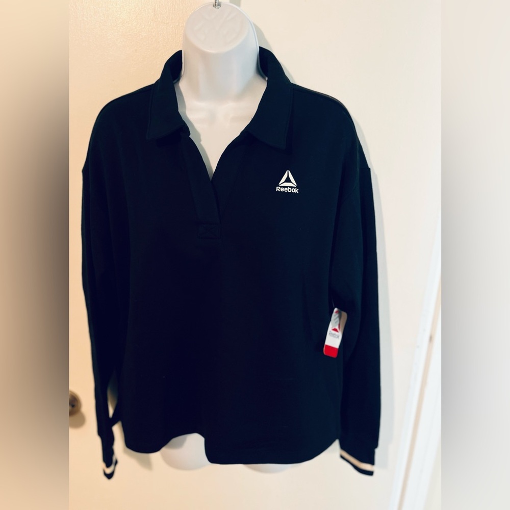 Reebok Women’s size Medium.  NWT Black collared sweatshirt.